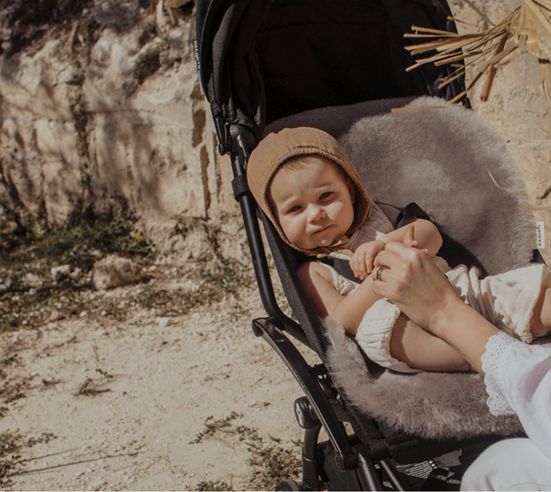 baby in pushchair